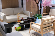 A living room filled with furniture and a tree